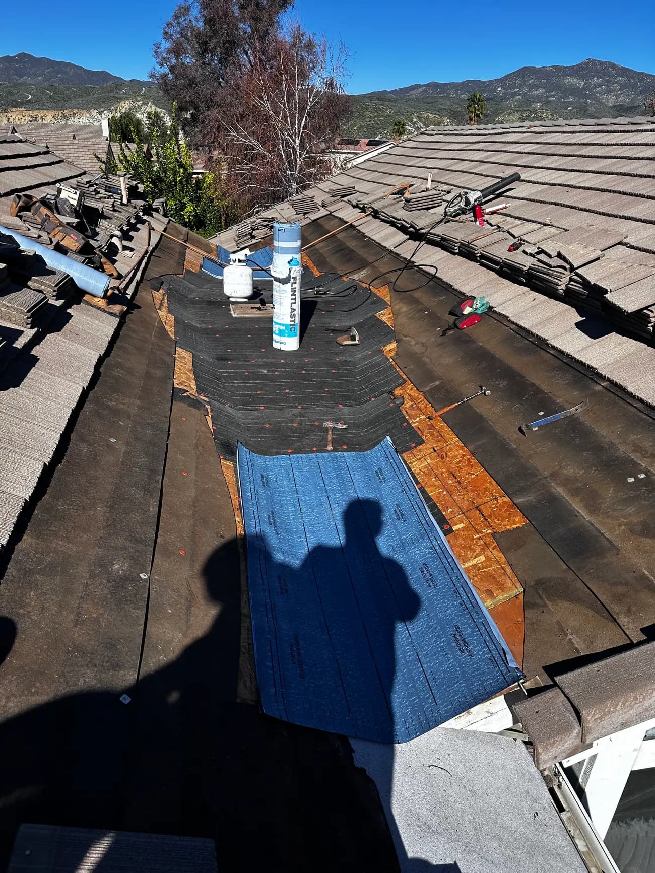 Roof underlayment exposed during a repair project