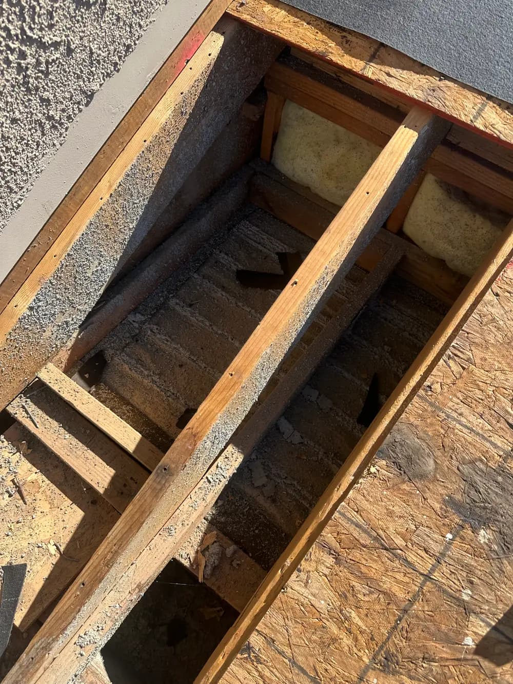 Exposed roof framing during a tile roof repair